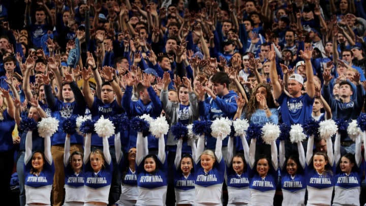 NEWARK, NEW JERSEY - NOVEMBER 14: Seton Hall Pirates fans and cheer staff pose during a free throw against the Michigan State Spartans at Prudential Center on November 14, 2019 in Newark, New Jersey. (Photo by Elsa/Getty Images)