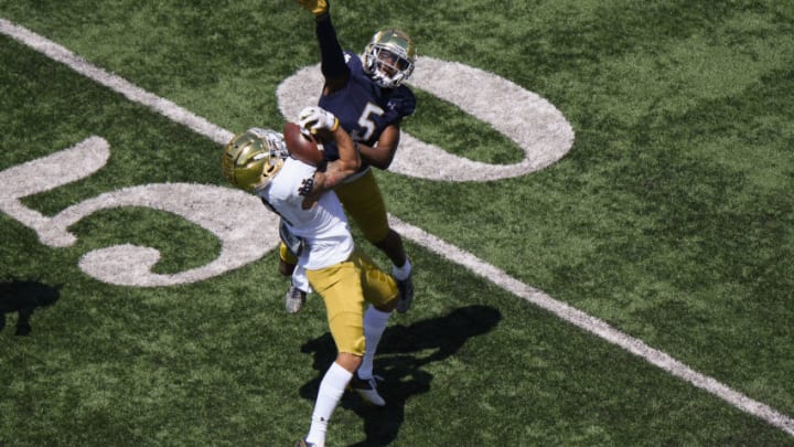SOUTH BEND, INDIANA - MAY 01: Joe Wilkins Jr. #18 of the Notre Dame Fighting Irish catches the football in the first half against Cam Hart #5 of the Notre Dame Fighting Irish Blue-Gold Spring Game at Notre Dame Stadium on May 01, 2021 in South Bend, Indiana. (Photo by Quinn Harris/Getty Images)