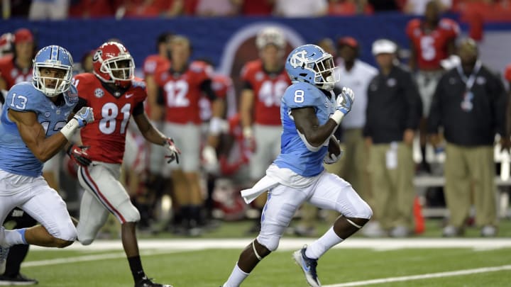 Sep 3, 2016; Atlanta, GA, USA; North Carolina Tar Heels running back T.J. Logan (8) returns a kickoff for a touchdown against the Georgia Bulldogs during the third quarter of the 2016 Chick-Fil-A Kickoff game at Georgia Dome. Mandatory Credit: Dale Zanine-USA TODAY Sports