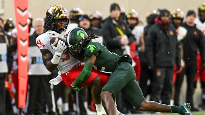 Michigan State’s Chester Kimbrough, right, tackles Maryland’s Mike Sainristil during the first quarter on Saturday, Nov. 13, 2021, at Spartan Stadium in East Lansing.211113 Msu Maryland 051a