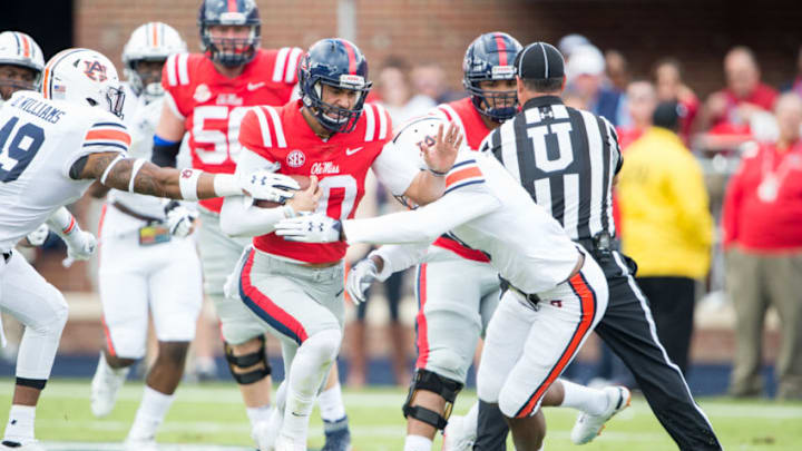 OXFORD, MS - OCTOBER 20: Quarterback Jordan Ta'amu #10 of the Mississippi Rebels runs the ball through traffic during the first quarter of their game against the Auburn Tigers at Vaught-Hemingway Stadium on October 20, 2018 in Oxford, Mississippi. (Photo by Michael Chang/Getty Images)