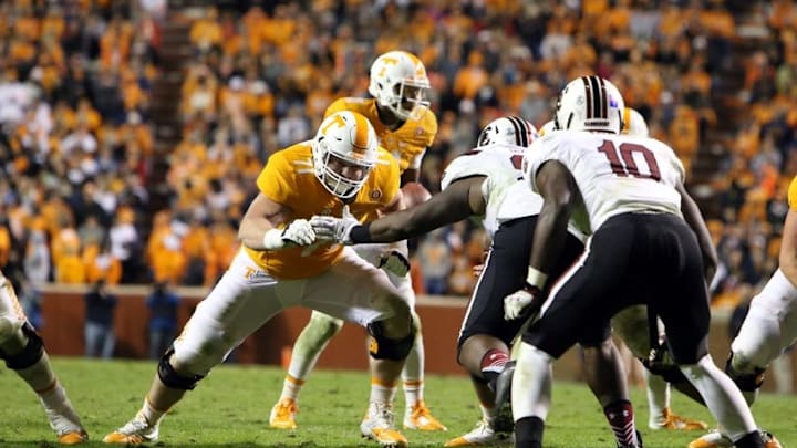 Nov 7, 2015; Knoxville, TN, USA; Tennessee Volunteers offensive lineman Dylan Wiesman (71) blocks for `Tennessee Volunteers quarterback Joshua Dobbs (11) against the South Carolina Gamecocks at Neyland Stadium. Mandatory Credit: Randy Sartin-USA TODAY Sports. Tennessee won 27 to 24.