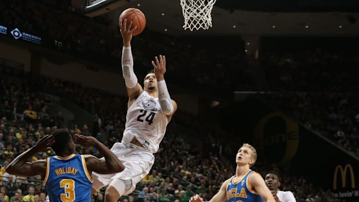Dec 28, 2016; Eugene, OR, USA; Oregon Ducks forward Dillon Brooks (24) shoots the ball as UCLA Bruins guard Aaron Holiday (3) and guard Isaac Hamilton (10) watch in the second half at Matthew Knight Arena. Mandatory Credit: Scott Olmos-USA TODAY Sports