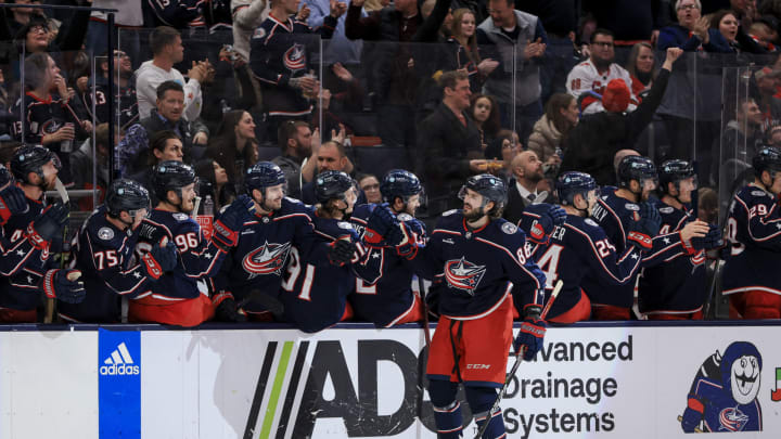 Jan 7, 2023; Columbus, Ohio, USA; Columbus Blue Jackets right wing Kirill Marchenko (right) celebrates with teammates after scoring his hat-trick goal against the Carolina Hurricanes in the third period at Nationwide Arena. Mandatory Credit: Aaron Doster-USA TODAY Sports