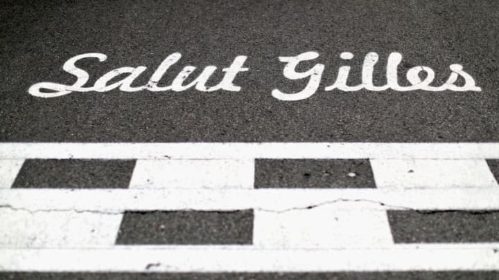 MONTREAL, QC - JUNE 11: Salut Gilles marking on the track for the circuits namesake Gilles Villeneuve during the Canadian Formula One Grand Prix at Circuit Gilles Villeneuve on June 11, 2017 in Montreal, Canada. Red Bull Racing Scuderia Toro Rosso (Photo by Mark Thompson/Getty Images)
