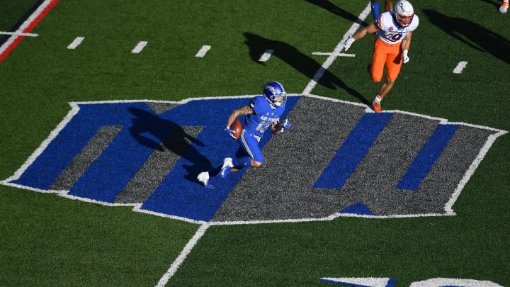 Oct 31, 2020; Colorado Springs, Colorado, USA; Air Force Falcons wide receiver Brandon Lewis (13) carries the ball over the Mountain West logo on the field against the Boise State Broncos in the first quarter at Falcon Stadium. Mandatory Credit: Ron Chenoy-USA TODAY Sports