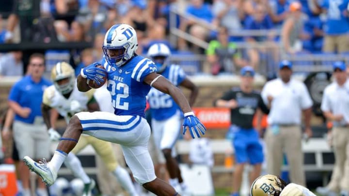 DURHAM, NC - SEPTEMBER 16: Brittain Brown #22 of the Duke Blue Devils high-steps out of a tackle by Ira Lewis #9 of the Baylor Bears during the game at Wallace Wade Stadium on September 16, 2017 in Durham, North Carolina. (Photo by Grant Halverson/Getty Images)
