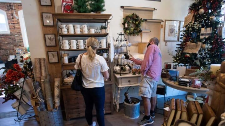 Jamie Glynn and her father, Pat Glynn, shop for holiday gifts at Rusted Arrow Mercantile in downtown Pensacola on Friday, Nov. 20, 2020.Rusted Arrow Cyber Monday
