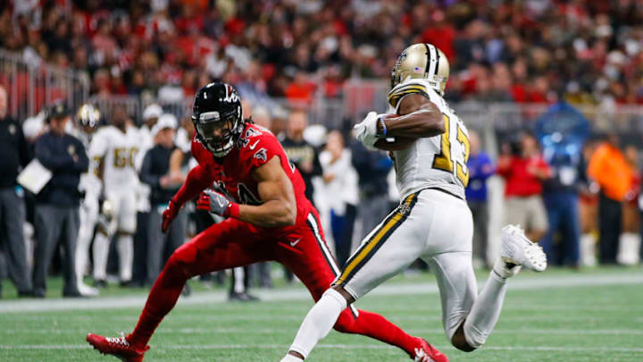 ATLANTA, GA - DECEMBER 07: New Orleans Saints wide receiver Michael Thomas (13) tries to get by a tackle of Atlanta Falcons outside linebacker Vic Beasley (44) during an NFL football game between the New Orleans Saints and Atlanta Falcons on December 7, 2017 at Mercedes-Benz Stadium. The Atlanta Falcons won the game 20-17. (Photo by Todd Kirkland/Icon Sportswire via Getty Images)