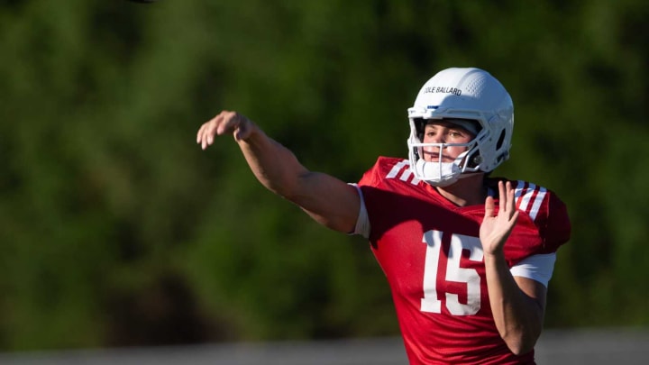 Kansas freshman quarterback Cole Ballard (15) fires a pass during Wednesday’s fall camp practice.