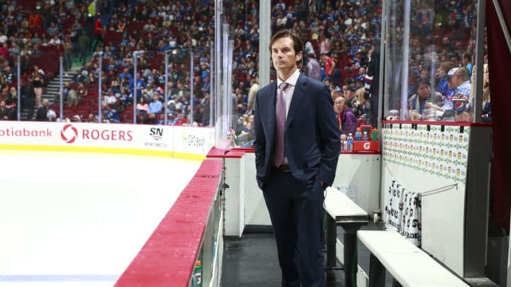 VANCOUVER, BC - OCTOBER 11: Head coach Dallas Eakins of the Edmonton Oilers looks on from the bench during their NHL game against the Vancouver Canucks at Rogers Arena October 11, 2014 in Vancouver, British Columbia, Canada. Vancouver won 5-4 in a shootout. (Photo by Jeff Vinnick/NHLI via Getty Images)