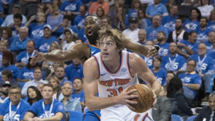 OKLAHOMA CITY, OK – OCTOBER 19: Ron Baker #31 of the New York Knicks drives around Raymond Felton #2 of the Oklahoma City Thunder during the second half of a NBA game at the Chesapeake Energy Arena on October 19, 2017 in Oklahoma City, Oklahoma. (Photo by J Pat Carter/Getty Images)
