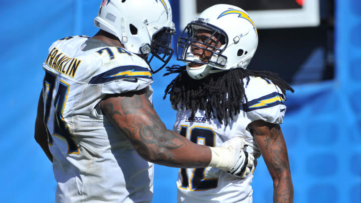 Sep 18, 2016; San Diego, CA, USA; San Diego Chargers wide receiver Travis Benjamin (12) celebrates a touchdown with offensive guard Orlando Franklin (74) during the second half of the game against the Jacksonville Jaguars at Qualcomm Stadium. San Diego won 38-14. Mandatory Credit: Orlando Ramirez-USA TODAY Sports