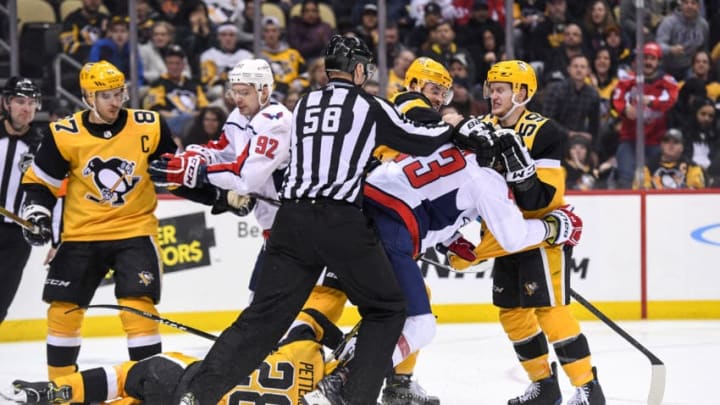 PITTSBURGH, PA - MARCH 12: Pittsburgh Penguins Defenseman Erik Gudbranson (44) and Washington Capitals Right Wing Tom Wilson (43) scrum after the play during the third period in the NHL game between the Pittsburgh Penguins and the Washington Capitals on March 12, 2019, at PPG Paints Arena in Pittsburgh, PA. (Photo by Jeanine Leech/Icon Sportswire via Getty Images)