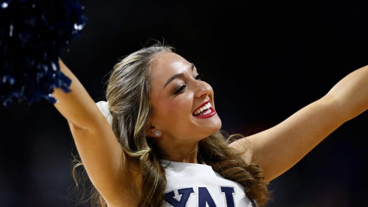 Mar 19, 2016; Providence, RI, USA; A Yale Bulldogs cheerleader cheers against the Duke Blue Devils during the second half of a second round game of the 2016 NCAA Tournament at Dunkin Donuts Center. Mandatory Credit: Mark L. Baer-USA TODAY Sports