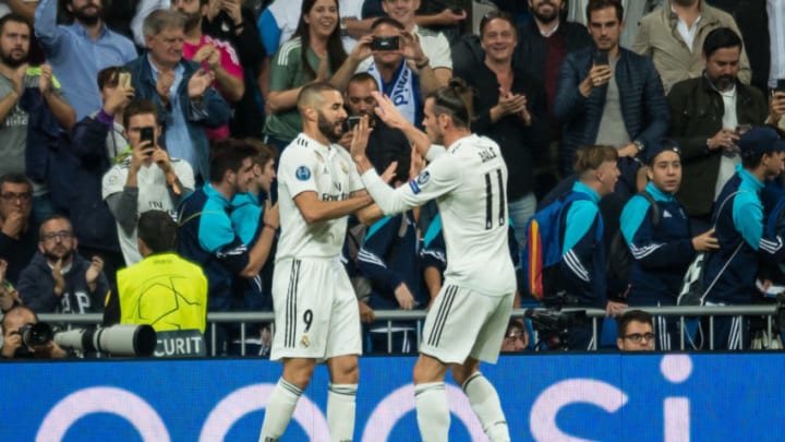 MADRID, SPAIN - OCTOBER 23: Karim Benzema of Real Madrid celebrates his goal with team mates during the UEFA Champions League Group G match between Real Madrid and Viktoria Plzen at Bernabeu on October 23, 2018 in Madrid, Spain. (Photo by TF-Images/Getty Images)
