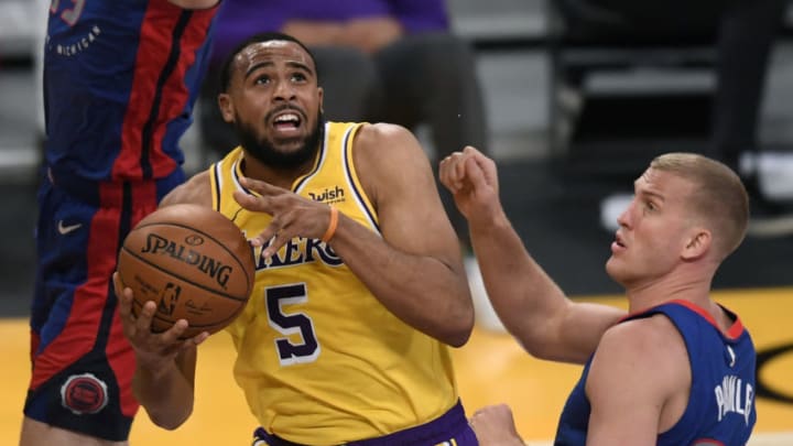 LOS ANGELES, CALIFORNIA - FEBRUARY 06: Talen Horton-Tucker #5 of the Los Angeles Lakers scores on a reverse layup in front of Mason Plumlee #24 of the Detroit Pistons during the first half at Staples Center on February 06, 2021 in Los Angeles, California. (Photo by Harry How/Getty Images) NOTE TO USER: User expressly acknowledges and agrees that, by downloading and/or using this Photograph, user is consenting to the terms and conditions of the Getty Images License Agreement. Mandatory Copyright Notice: Copyright 2021 NBAE.