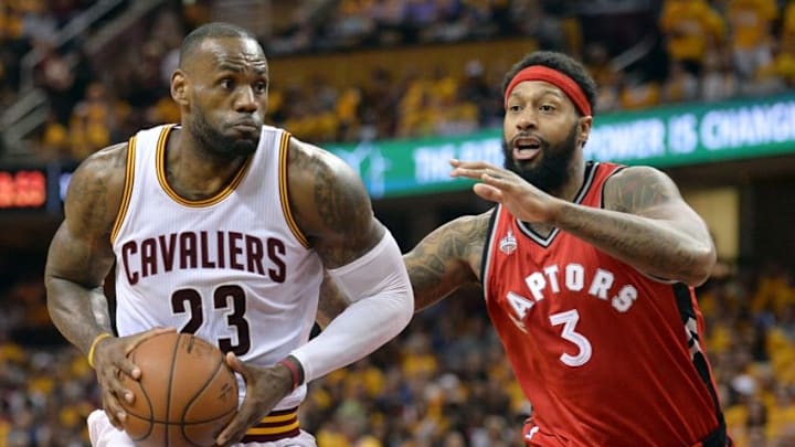 May 19, 2016; Cleveland, OH, USA; Toronto Raptors forward James Johnson (3) defends Cleveland Cavaliers forward LeBron James (23) during the second half in game two of the Eastern conference finals of the NBA Playoffs at Quicken Loans Arena. The Cavs won 108-89. Mandatory Credit: Ken Blaze-USA TODAY Sports