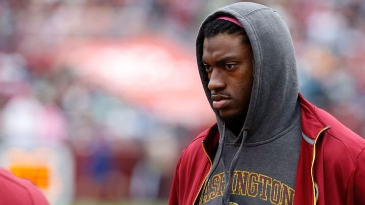 Oct 4, 2015; Landover, MD, USA; Washington Redskins quarterback Robert Griffin III stands the bench against the Philadelphia Eagles at FedEx Field. Mandatory Credit: Geoff Burke-USA TODAY Sports