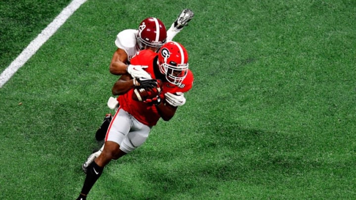 ATLANTA, GA - JANUARY 08: Terry Godwin #5 of the Georgia Bulldogs is tackled by Minkah Fitzpatrick #29 of the Alabama Crimson Tide after a catch during teh first quarter in the CFP National Championship presented by AT&T at Mercedes-Benz Stadium on January 8, 2018 in Atlanta, Georgia. (Photo by Scott Cunningham/Getty Images) ATLANTA, GA - JANUARY 08: Terry Godwin #5 of the Georgia Bulldogs is tackled by Minkah Fitzpatrick #29 of the Alabama Crimson Tide after a catch during teh first quarter in the CFP National Championship presented by AT&T at Mercedes-Benz Stadium on January 8, 2018 in Atlanta, Georgia. (Photo by Scott Cunningham/Getty Images)