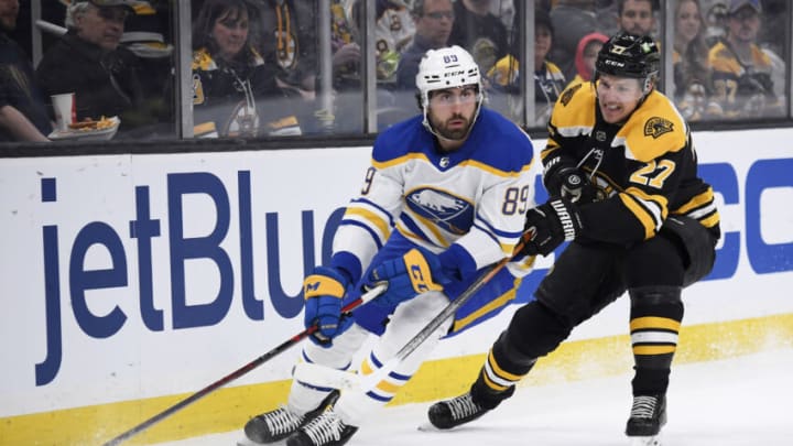 Apr 28, 2022; Boston, Massachusetts, USA; Buffalo Sabres right wing Alex Tuch (89) controls the puck against Boston Bruins defenseman Hampus Lindholm (27) during the first period at TD Garden. Mandatory Credit: Bob DeChiara-USA TODAY Sports