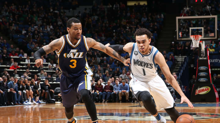 MINNEAPOLIS, MN – DECEMBER 30: Tyus Jones #1 of the Minnesota Timberwolves handles the ball against Trey Burke #3 of the Utah Jazz on December 30, 2015 at Target Center in Minneapolis, Minnesota. NOTE TO USER: User expressly acknowledges and agrees that, by downloading and or using this Photograph, user is consenting to the terms and conditions of the Getty Images License Agreement. Mandatory Copyright Notice: Copyright 2015 NBAE (Photo by David Sherman/NBAE via Getty Images)