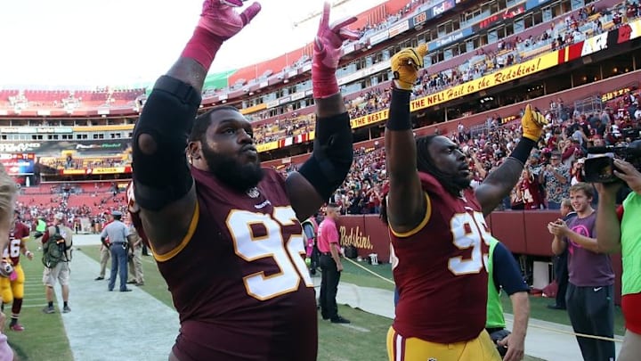 Oct 16, 2016; Landover, MD, USA; Washington Redskins defensive end Chris Baker (92) and Redskins defensive end Ricky Jean Francois (99) celebrate while leaving the field after their game against the Philadelphia Eagles at FedEx Field. The Redskins won 27-20. Mandatory Credit: Geoff Burke-USA TODAY Sports