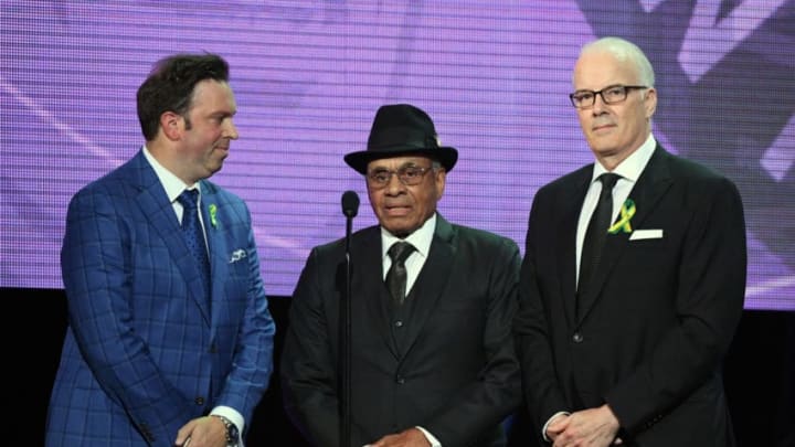 LAS VEGAS, NV - JUNE 20: Former NHL player Willie O'Ree (C) presents the inaugural Willie O'Ree Community Hero Award as sportscasters Elliotte Friedman (L) and Scott Oake (R) look on during the 2018 NHL Awards presented by Hulu at The Joint inside the Hard Rock Hotel & Casino on June 20, 2018 in Las Vegas, Nevada. (Photo by Ethan Miller/Getty Images)
