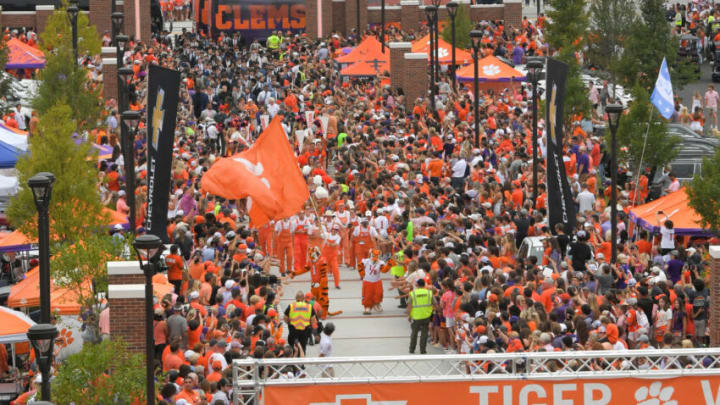 Sep 16, 2023; Clemson, South Carolina, USA; Clemson Tigers football fans watch the team walk in for Tiger Walk before a game against the Florida Atlantic Owls at Memorial Stadium. Mandatory Credit: Ken Ruinard-USA TODAY Sports
