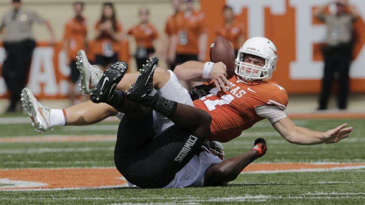 AUSTIN, TX – OCTOBER 21: Trey Carter #99 of the Oklahoma State Cowboys sacks Sam Ehlinger #11 of the Texas Longhorns and forces a fumble in the second quarter at Darrell K Royal-Texas Memorial Stadium on October 21, 2017 in Austin, Texas. (Photo by Tim Warner/Getty Images)