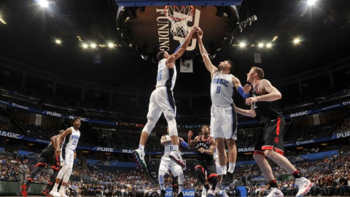 ORLANDO, FL - FEBRUARY 28: Evan Fournier #10 and Nikola Vucevic #9 of the Orlando Magic rebounds the ball during the game against the Toronto Raptors on February 28, 2018 at Amway Center in Orlando, Florida. NOTE TO USER: User expressly acknowledges and agrees that, by downloading and or using this photograph, User is consenting to the terms and conditions of the Getty Images License Agreement. Mandatory Copyright Notice: Copyright 2018 NBAE (Photo by Fernando Medina/NBAE via Getty Images)