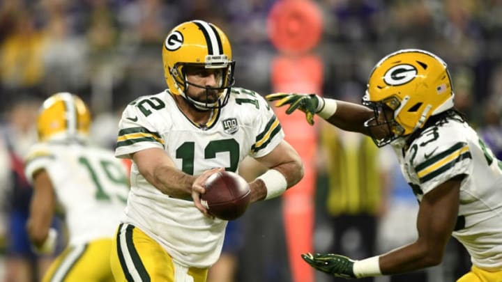 MINNEAPOLIS, MN - NOVEMBER 25: Aaron Rodgers #12 of the Green Bay Packers hands the ball off to Aaron Jones #33 in the first quarter of the game against the Minnesota Vikings at U.S. Bank Stadium on November 25, 2018 in Minneapolis, Minnesota. (Photo by Hannah Foslien/Getty Images)