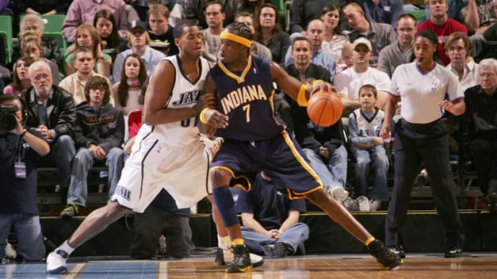 SALT LAKE CITY - NOVEMBER 29: Jermaine O'Neal #7 of the Indiana Pacers dribbles the ball against Jarron Collins #31 of the Utah Jazz on November 29, 2005 at the Delta Center in Salt Lake City, Utah. Copyright 2005 NBAE (Photo by Kent Horner/NBAE via Getty Images)