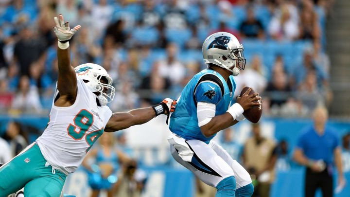 CHARLOTTE, NC – AUGUST 17: Robert Quinn #94 of the Miami Dolphins rushes Cam Newton #1 of the Carolina Panthers in the first quarter during the game at Bank of America Stadium on August 17, 2018 in Charlotte, North Carolina. (Photo by Grant Halverson/Getty Images)