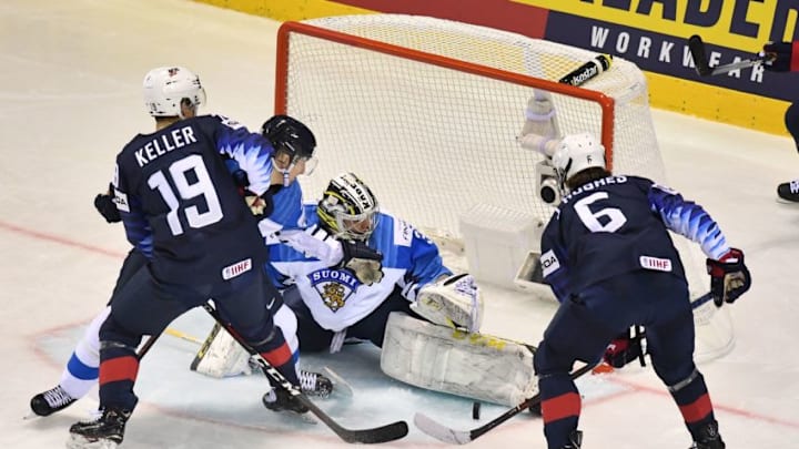 United States' forward Clayton Keller (L) and United States' forward Jack Hughes vie with Finland's goalkeeper Veini Vehvilainen during the IIHF Men's Ice Hockey World Championships Group A match between USA and Finland on May 13, 2019 in Kosice, Slovakia. (Photo by JOE KLAMAR / AFP) (Photo credit should read JOE KLAMAR/AFP/Getty Images)