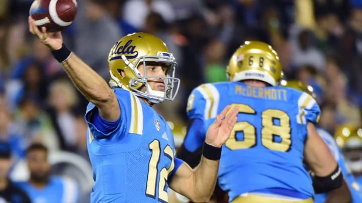 PASADENA, CA - NOVEMBER 19: Quarterback Mike Fafaul #12 of the UCLA Bruins makes a throw in the pocket against the USC Trojans at Rose Bowl on November 19, 2016 in Pasadena, California. (Photo by Harry How/Getty Images)