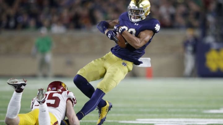 SOUTH BEND, IN - OCTOBER 21: Chase Claypool #83 of the Notre Dame Fighting Irish tries to break a tackle after a catch against Cameron Smith #35 of the USC Trojans in the third quarter of a game at Notre Dame Stadium on October 21, 2017 in South Bend, Indiana. Notre Dame won 49-14. (Photo by Joe Robbins/Getty Images)