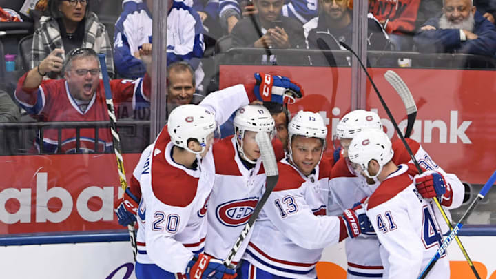 TORONTO, ON - OCTOBER 05: Montreal Canadiens Center Max Domi (13) celebrates a goal with Left Wing Paul Byron (41) and Defenceman Cale Fleury (20) during the regular season NHL game between the Montreal Canadiens and Toronto Maple Leafs on October 5, 2019 at Scotiabank Arena in Toronto, ON. (Photo by Gerry Angus/Icon Sportswire via Getty Images)