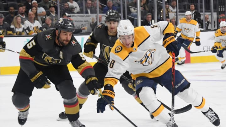 LAS VEGAS, NEVADA - OCTOBER 15: Kyle Turris #8 of the Nashville Predators skates with the puck against Deryk Engelland #5 of the Vegas Golden Knights in the third period of their game at T-Mobile Arena on October 15, 2019 in Las Vegas, Nevada. The Predators defeated the Golden Knights 5-2. (Photo by Ethan Miller/Getty Images)
