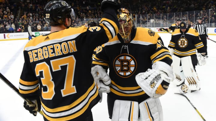 BOSTON, MA - DECEMBER 23: Patrice Bergeron #37 and Tuukka Rask #40 of the Boston Bruins celebrate the win against the Washington Capitals at the TD Garden on December 23, 2019 in Boston, Massachusetts. (Photo by Steve Babineau/NHLI via Getty Images)