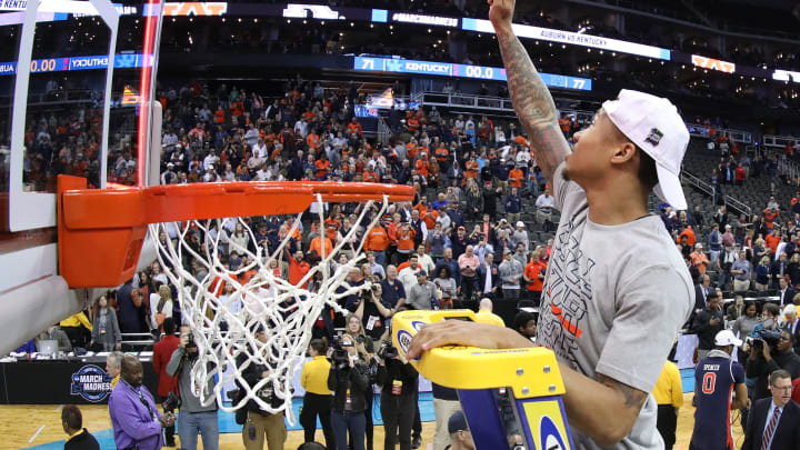 KANSAS CITY, MISSOURI – MARCH 31: J’Von McCormick #12 of the Auburn Tigers celebrates by cutting down the net after their 77-71 win over the Kentucky Wildcats in the 2019 NCAA Basketball Tournament Midwest Regional at Sprint Center on March 31, 2019 in Kansas City, Missouri. (Photo by Jamie Squire/Getty Images)
