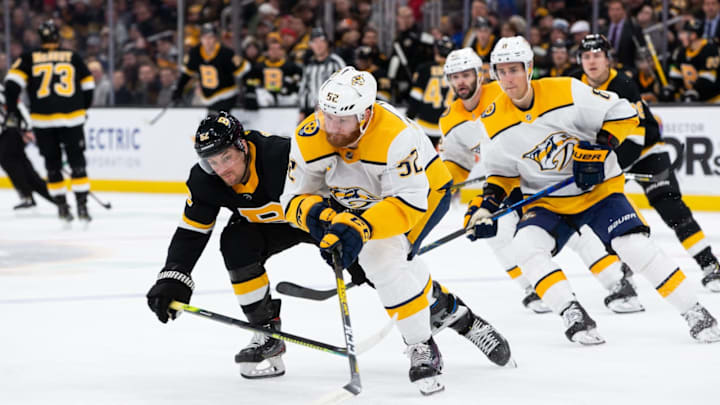 BOSTON, MA – DECEMBER 21: Sean Kuraly #52 of the Boston Bruins checks Matt Irwin #52 of the Nashville Predators  (Photo by Rich Gagnon/Getty Images)