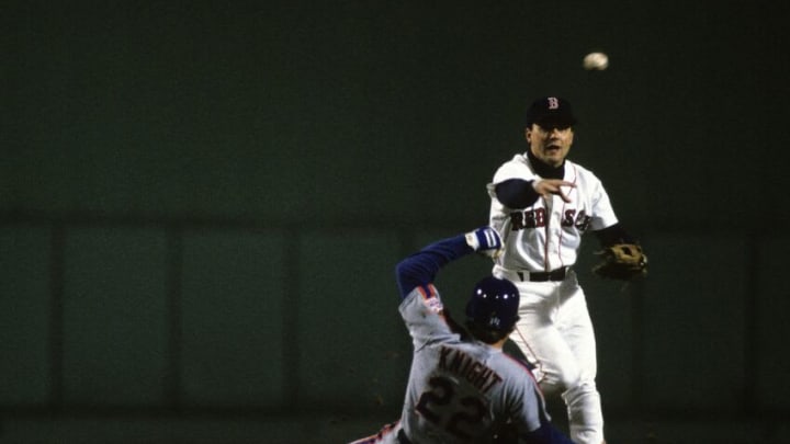 BOSTON, MA - OCTOBER 22, 1986: Spike Owen #7 of the Boston Red Sox throws to first base during Game 4 of the 1986 World Series against the New York Mets in Fenway Park on October 22, 1986 in Boston, Massachusetts. (Photo by Ronald C. Modra/Getty Images)