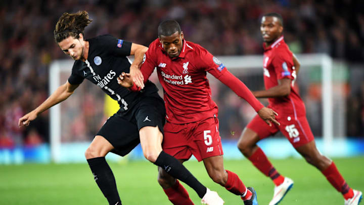 LIVERPOOL, ENGLAND - SEPTEMBER 18: Georginio Wijnaldum of Liverpool battles with Adrien Rabiot of Paris Saint-Germain during the Group C match of the UEFA Champions League between Liverpool and Paris Saint-Germain at Anfield on September 18, 2018 in Liverpool, United Kingdom. (Photo by Michael Regan/Getty Images)