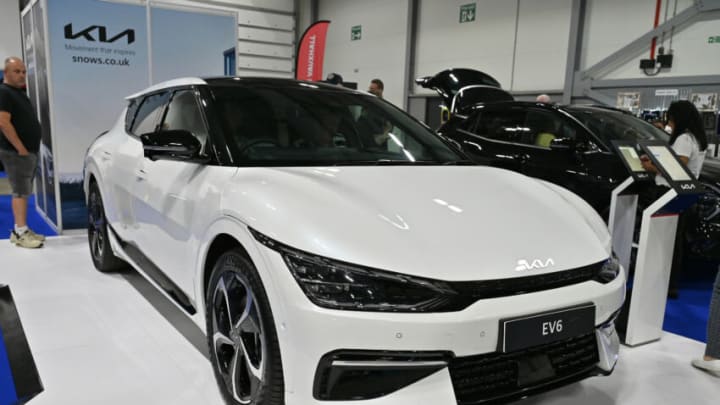 FARNBOROUGH, ENGLAND - AUGUST 17: A KIA EV6 is displayed during the British Motor Show at Farnborough International Exhibition Centre on August 17, 2023 in Farnborough, England. The family-friendly automotive show features supercar parades, stunt shows, live auctions, expert advice on sustainable motoring options and gives visitors the chance to test drive the latest models. (Photo by John Keeble/Getty Images)