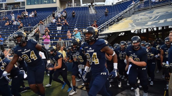 Sep 1, 2016; Miami, FL, USA; Fiu Golden Panthers teammates take the field before the game against the Indiana Hoosiers at FIU Stadium. The Indiana Hoosiers defeat the FIU Golden Panthers 34 -13. Mandatory Credit: Jasen Vinlove-USA TODAY Sports