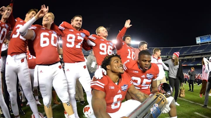 Dec 30, 2015; San Diego, CA, USA; Wisconsin Badgers players pose with the championship trophy after the 2015 Holiday Bowl against the Southern California Trojans at Qualcomm Stadium. Wisconsin defeated USC 23-21. Mandatory Credit: Kirby Lee-USA TODAY Sports