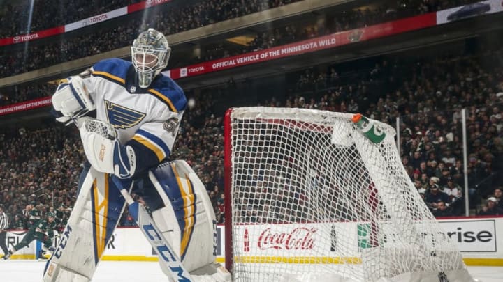 ST. PAUL, MN - FEBRUARY 17: Jordan Binnington #50 of the St. Louis Blues plays the puck behind his net during a game with the Minnesota Wild at Xcel Energy Center on February 17, 2019 in St. Paul, Minnesota.(Photo by Bruce Kluckhohn/NHLI via Getty Images)