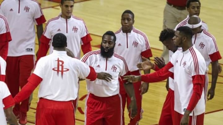 Oct 24, 2014; Houston, TX, USA; Houston Rockets guard James Harden (center) is introduced before a game against the San Antonio Spurs at Toyota Center. Mandatory Credit: Troy Taormina-USA TODAY Sports