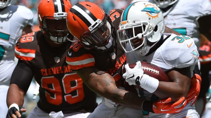 Sep 25, 2016; Miami Gardens, FL, USA; Cleveland Browns inside linebacker Chris Kirksey (58) tackles Miami Dolphins running back Kenyan Drake (32) during the first half at Hard Rock Stadium. Mandatory Credit: Jasen Vinlove-USA TODAY Sports